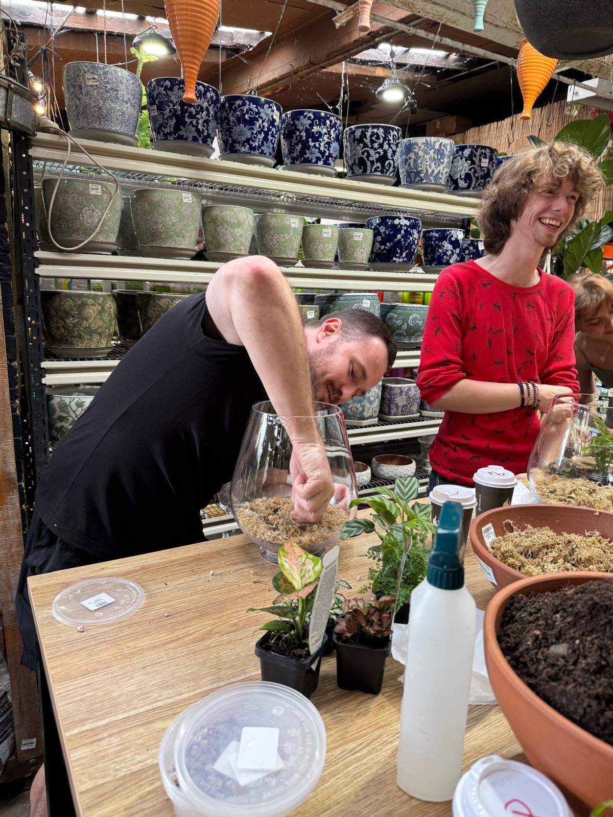 Terrarium workshop attendees building at the main table, Newtown Garden Market