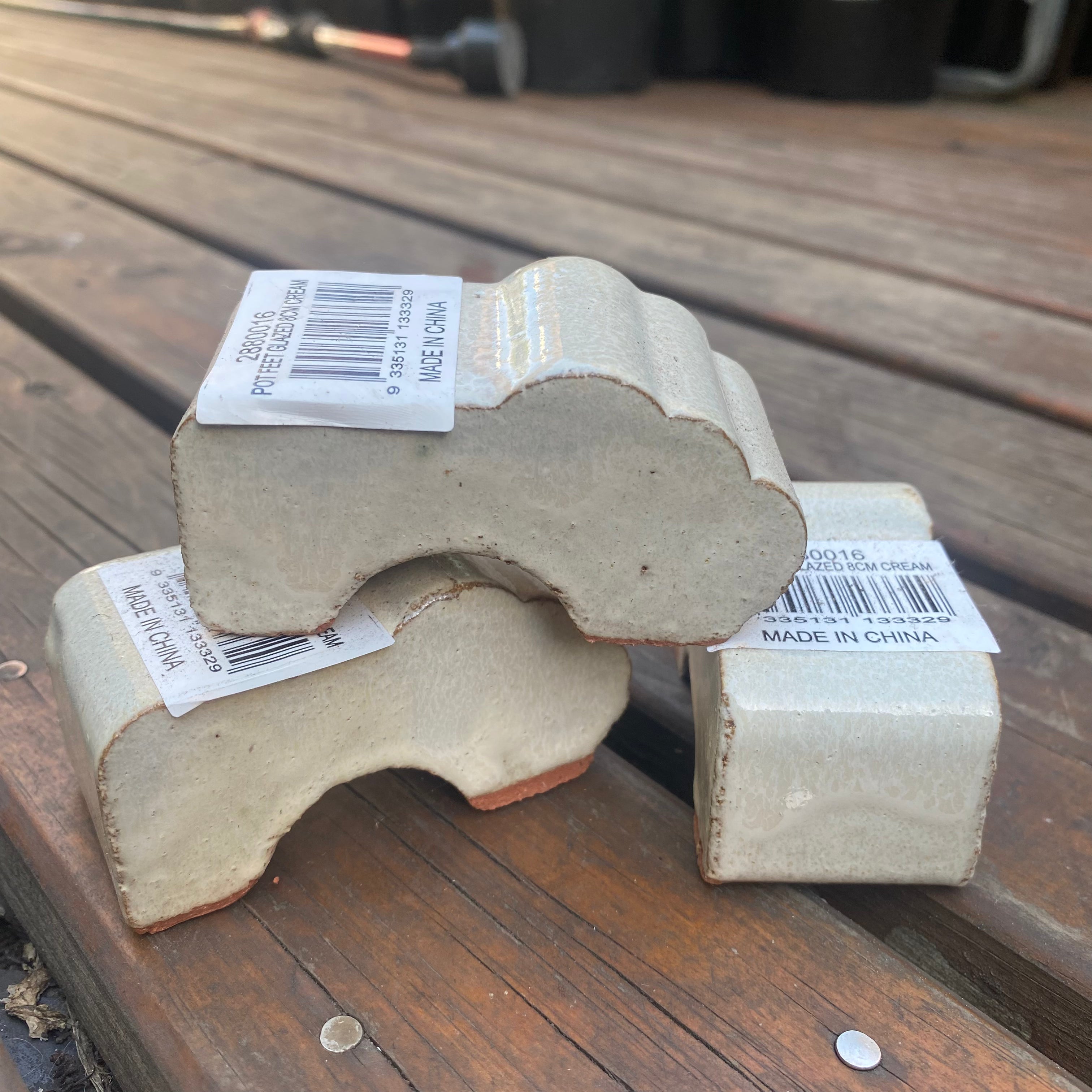 Glazed Pot Feet 8cm -- Cream on white background